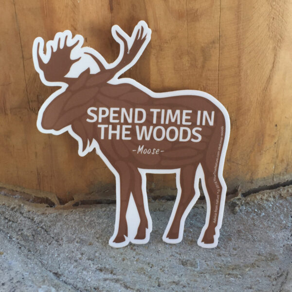 Moose shaped sticker with spend more time in the woods on it.