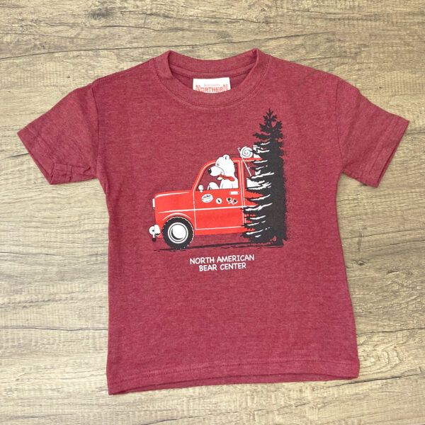 Brick red toddler shirt with a fun bear driving a truck with a tree screen printed on the front.